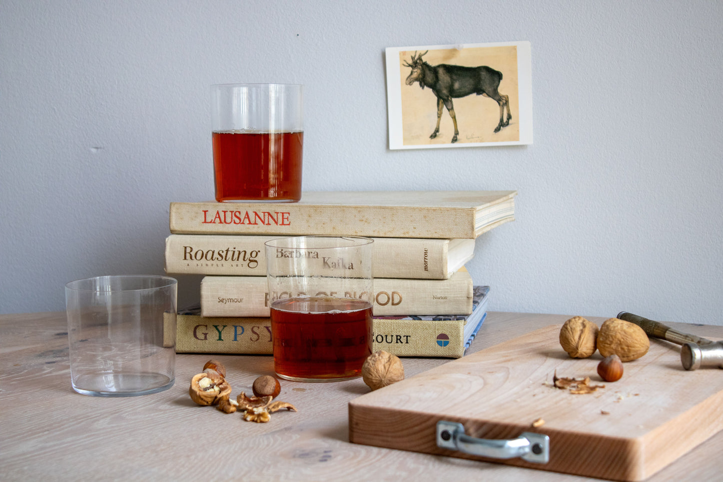 Two glasses of cider on books